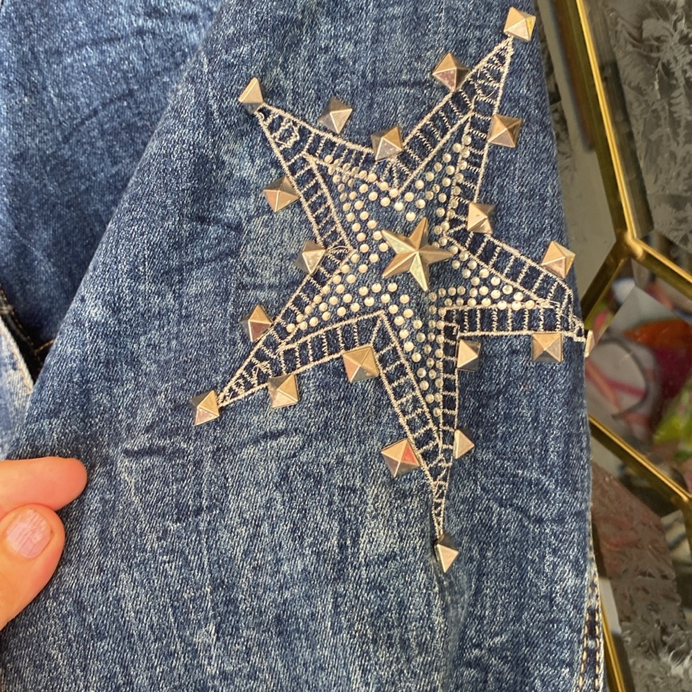 Jean jacket with shinny starts.